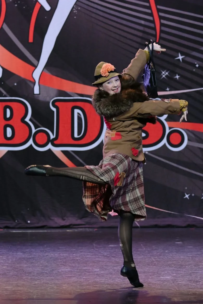 JMDS soloist performing a character solo on stage
